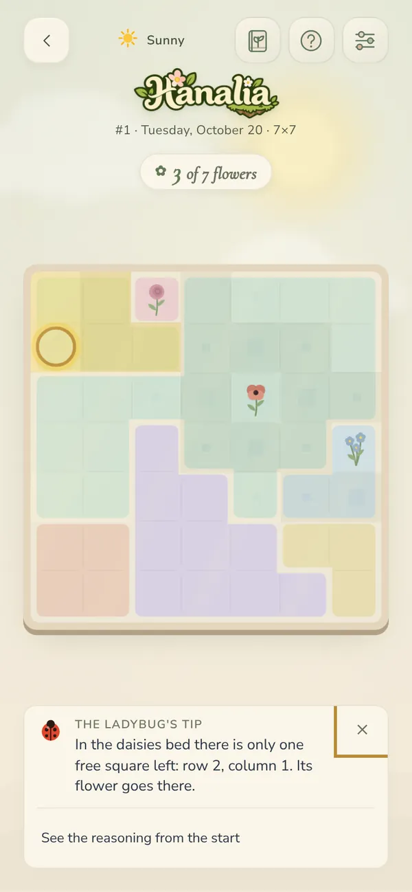 A Hanalia board with flowers planted and a hint from the ladybug
